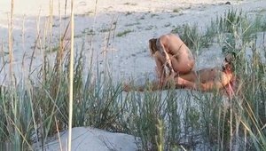 Muscle couple really likes caught hard pounding at the beach
