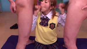 Young asian college teen stroking in classroom